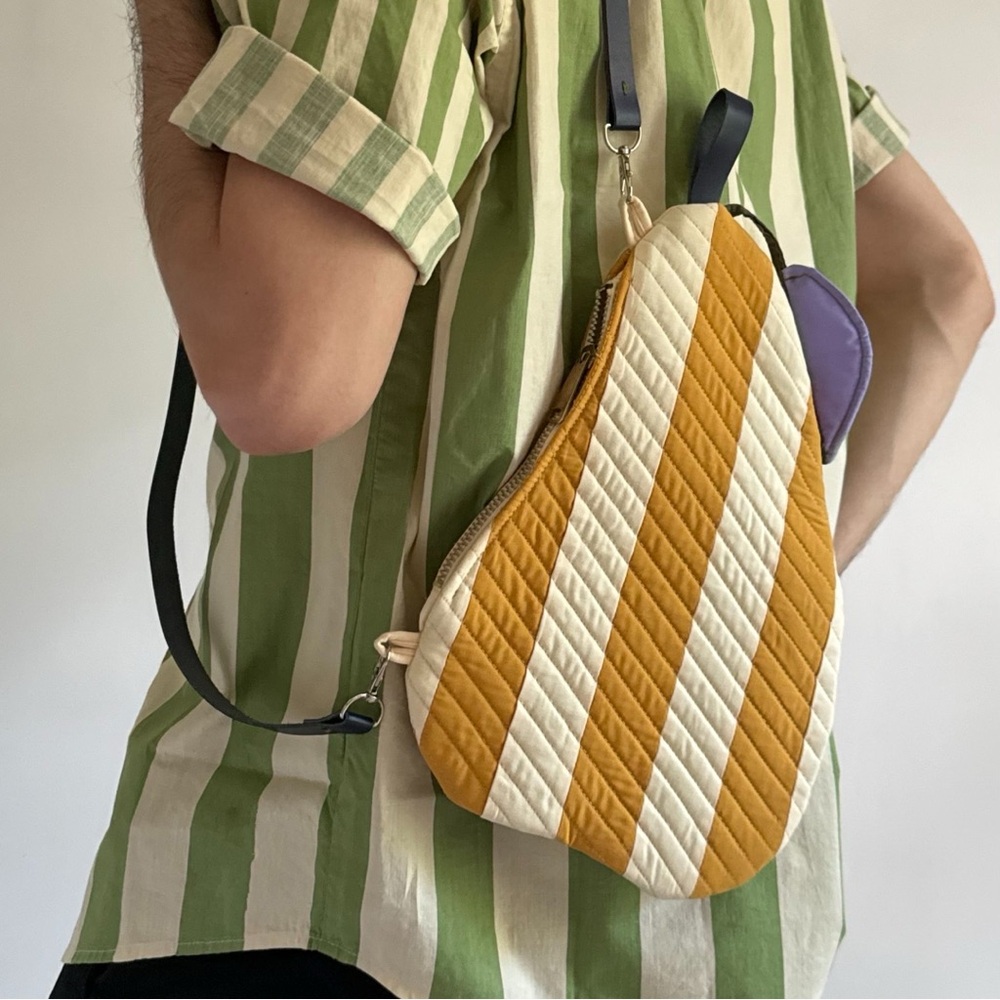 Pear shaped quilted bag in yellow white stripes with leather strap. craftcore